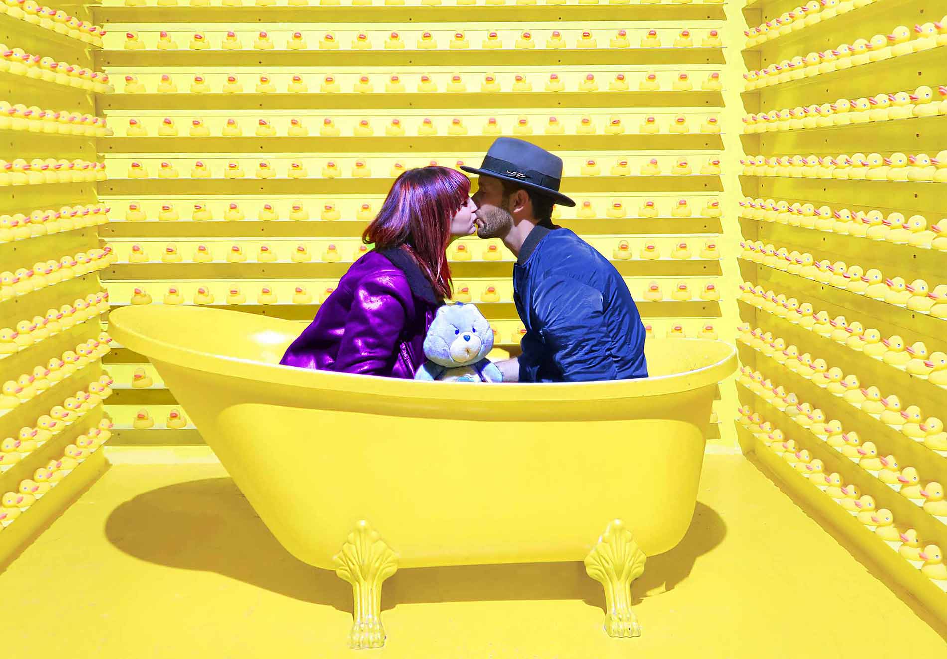 Couple Sharing Kiss in Yellow Bathtub